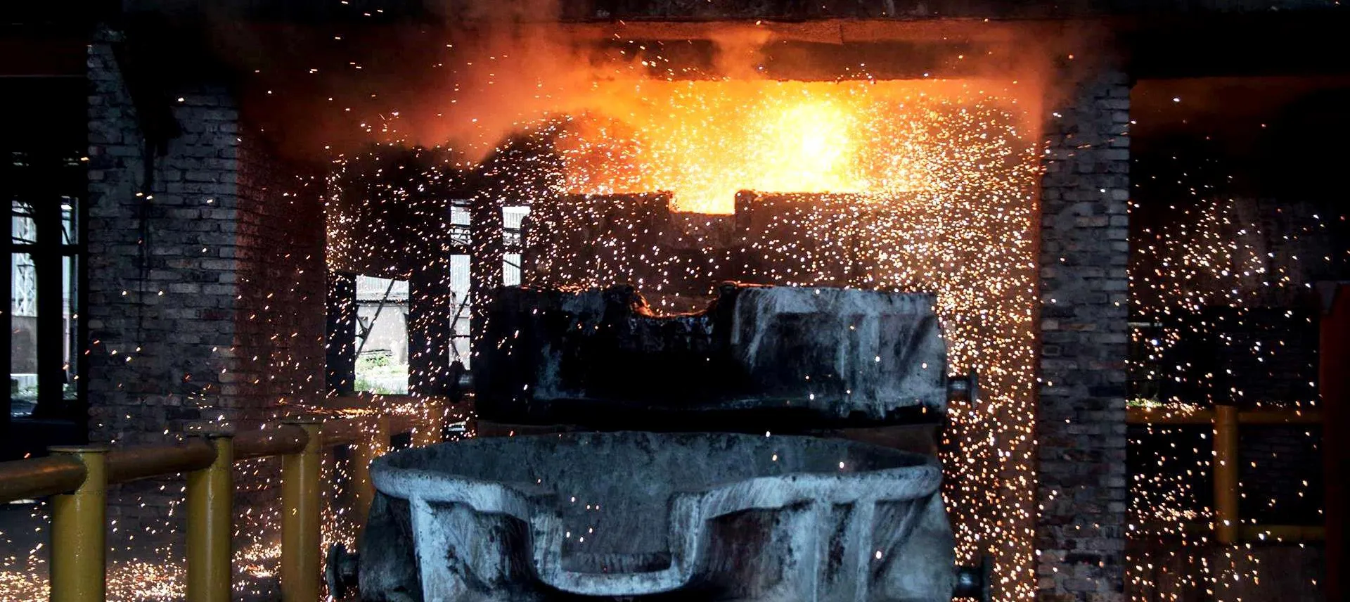 Molten steel pour at a metallurgical plant β sparks and red-hot metal